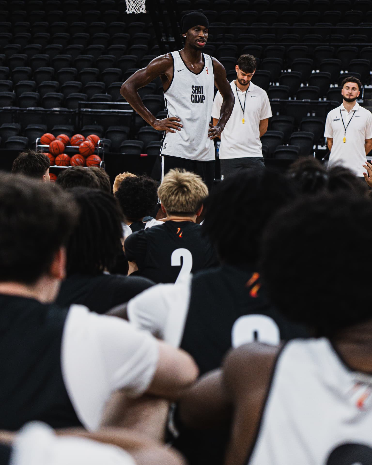 Shai Gilgeous-Alexander speaking with young athletes at SGA Camp